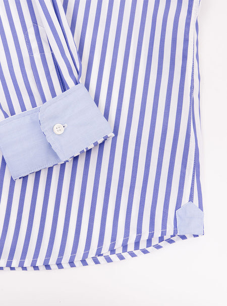 Flat lay of men's long sleeved shirt with royal blue and white stripe pattern. Made with 100% cotton in Thomas Mason fabric.